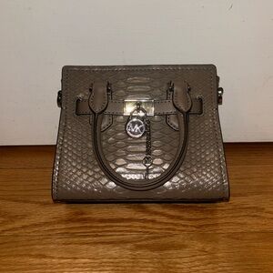 This is a brand new brown Micheal Kors crossbody bag with silver hardware!